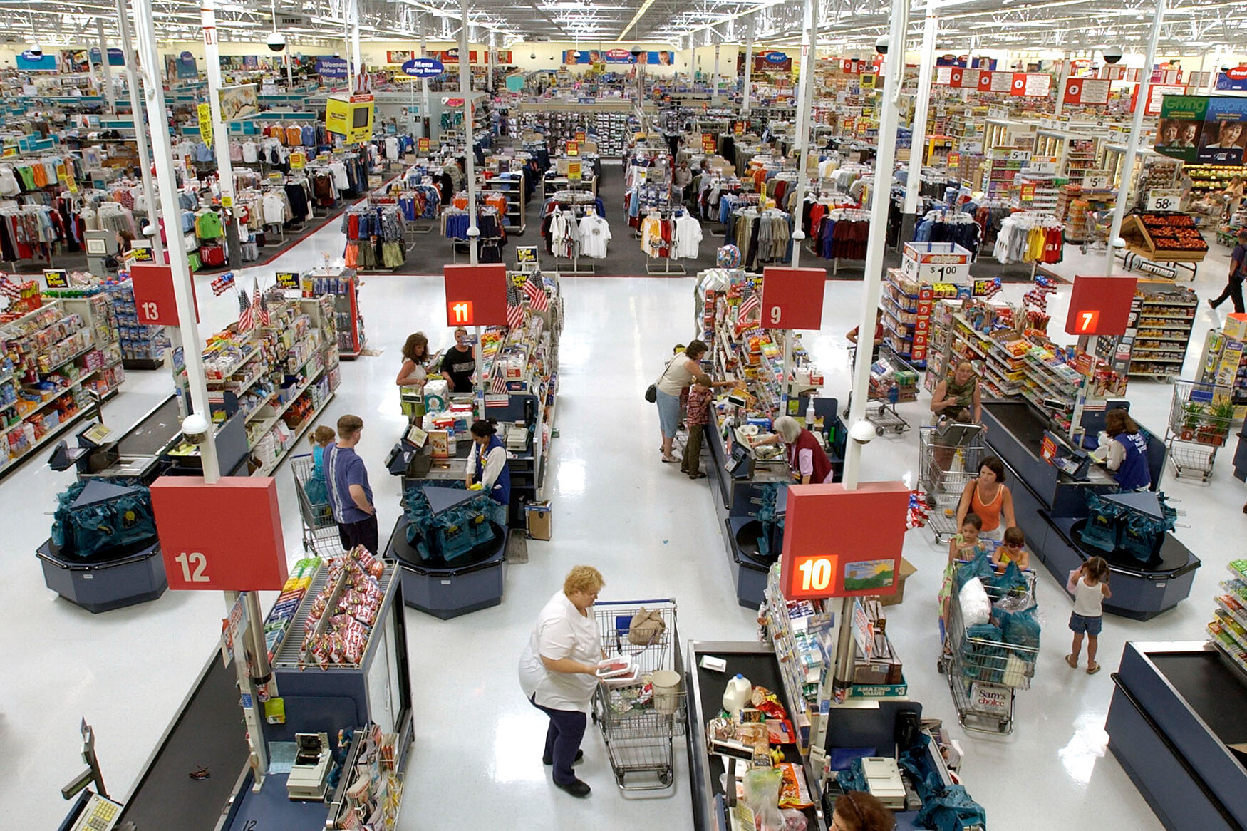 Shoppers check out at the counters of the Wal-Mart supercenter